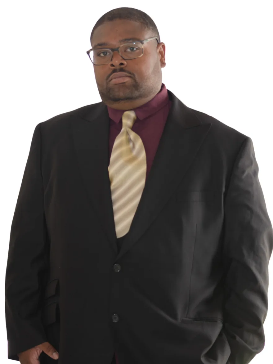 Kennth Williams, Development Manager, in a dark suit and striped tie