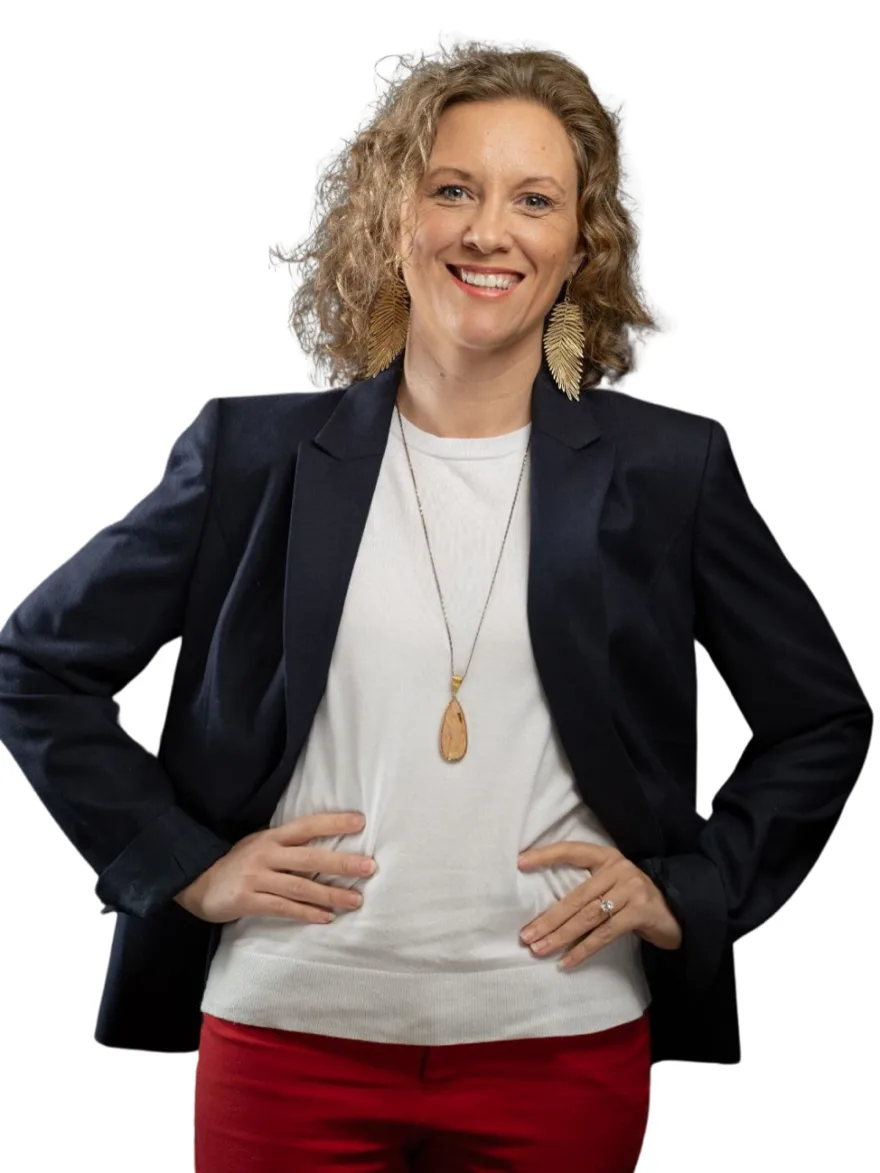 Leslie Geick, Voluntary Benefits Manager, smiling with hands on hips