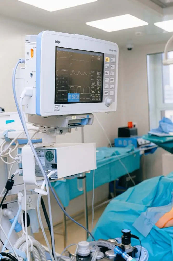 Hospital monitoring equipment beside a patient bed