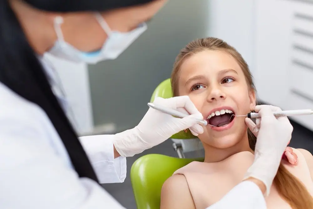 Child receiving a dental checkup