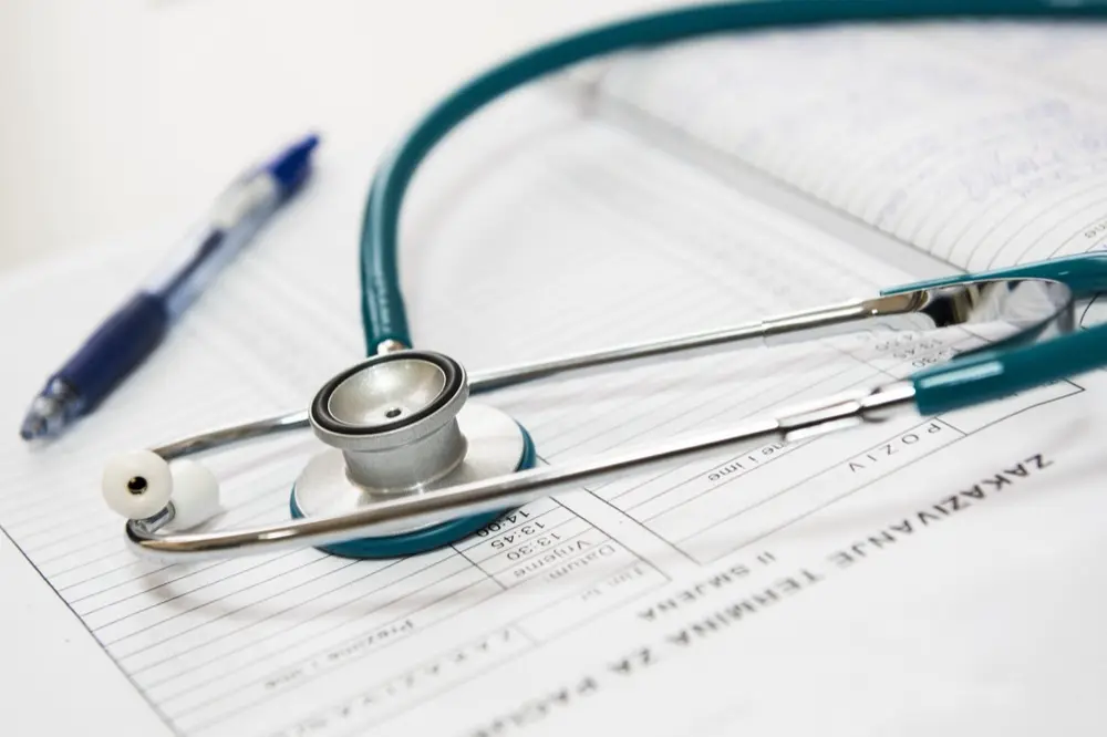 Stethoscope resting on medical paperwork